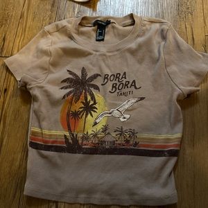 Brown cropped t shirt with graphics in a size small